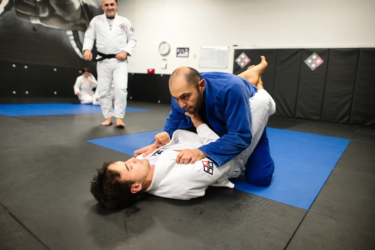 Adult learning BJJ guard pass near Toronto at Yorkdale Martial Arts Academy - passing techniques
