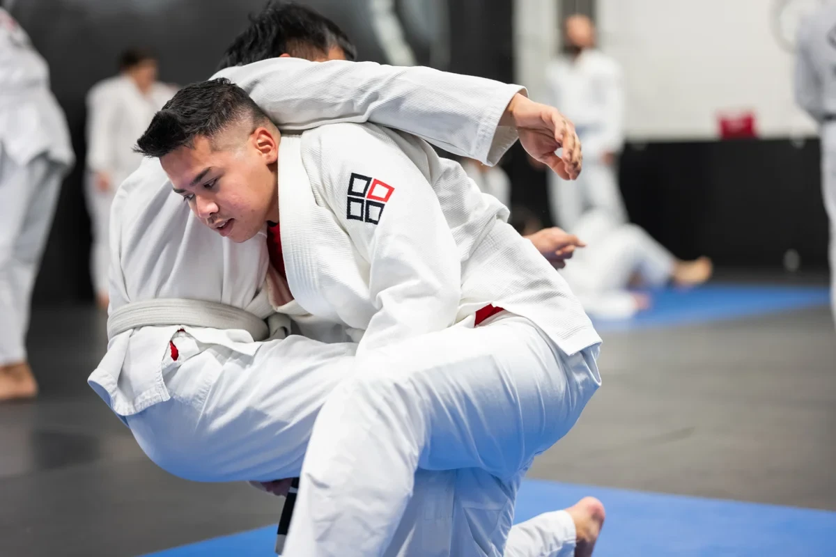 Adult practicing BJJ guard position at Yorkdale Martial Arts Academy in York