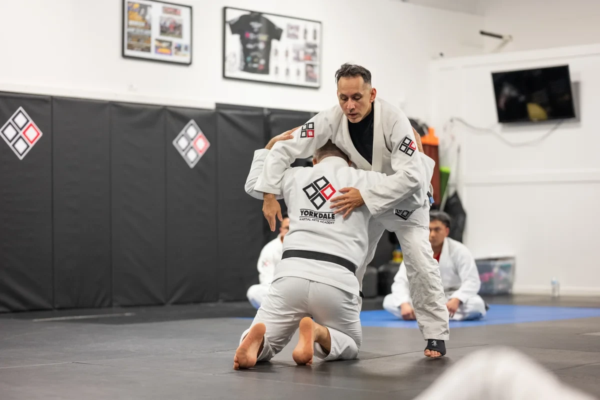 BJJ instructor demonstrating technique for Toronto area students - expert coaching