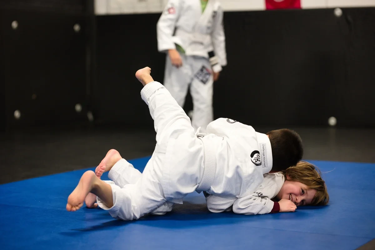 Children having fun grappling in kids BJJ class at Yorkdale Martial Arts