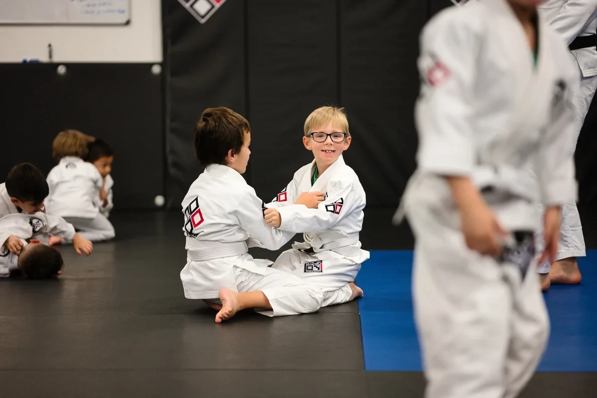 Children practicing BJJ partner drills at Yorkdale Martial Arts Academy