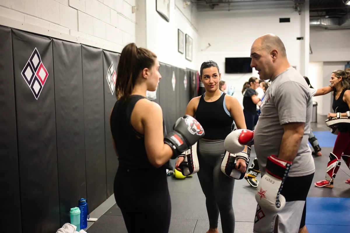 Muay Thai instructor coaching students at Yorkdale Martial Arts Academy